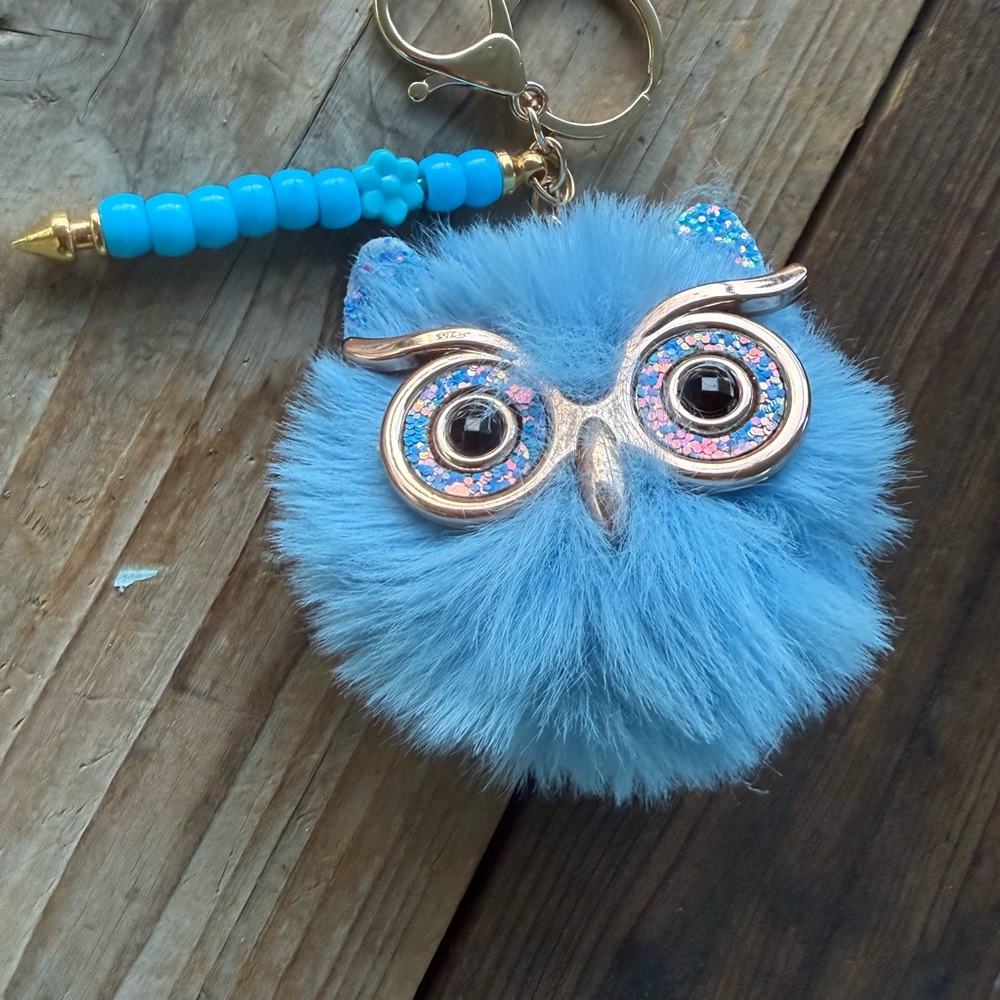 Fuzzy blue owl on gold keychain bar with sparkles glasses . Blue pony beads.